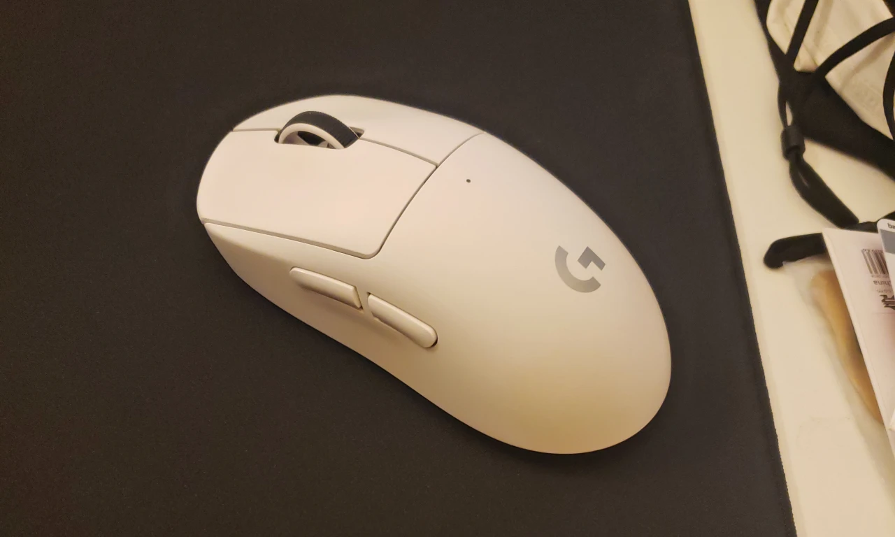 White Color Logitech G Pro X Superlight 2 on the Black Mouse Pad