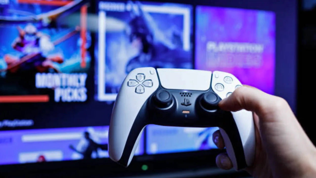 A person holding PS5 dual controller in hand.