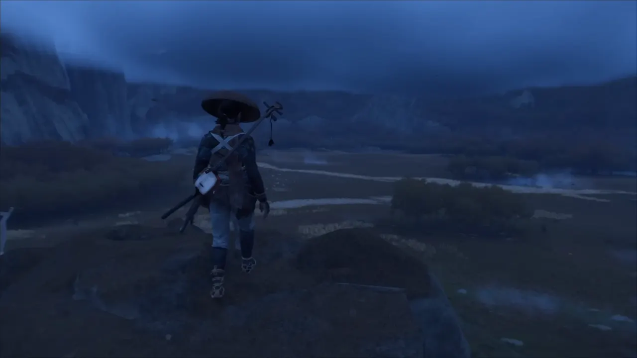 Atsu standing on tall cliff edge looking at massive open world of Ghost of Yotei's Ezo island in Japan.