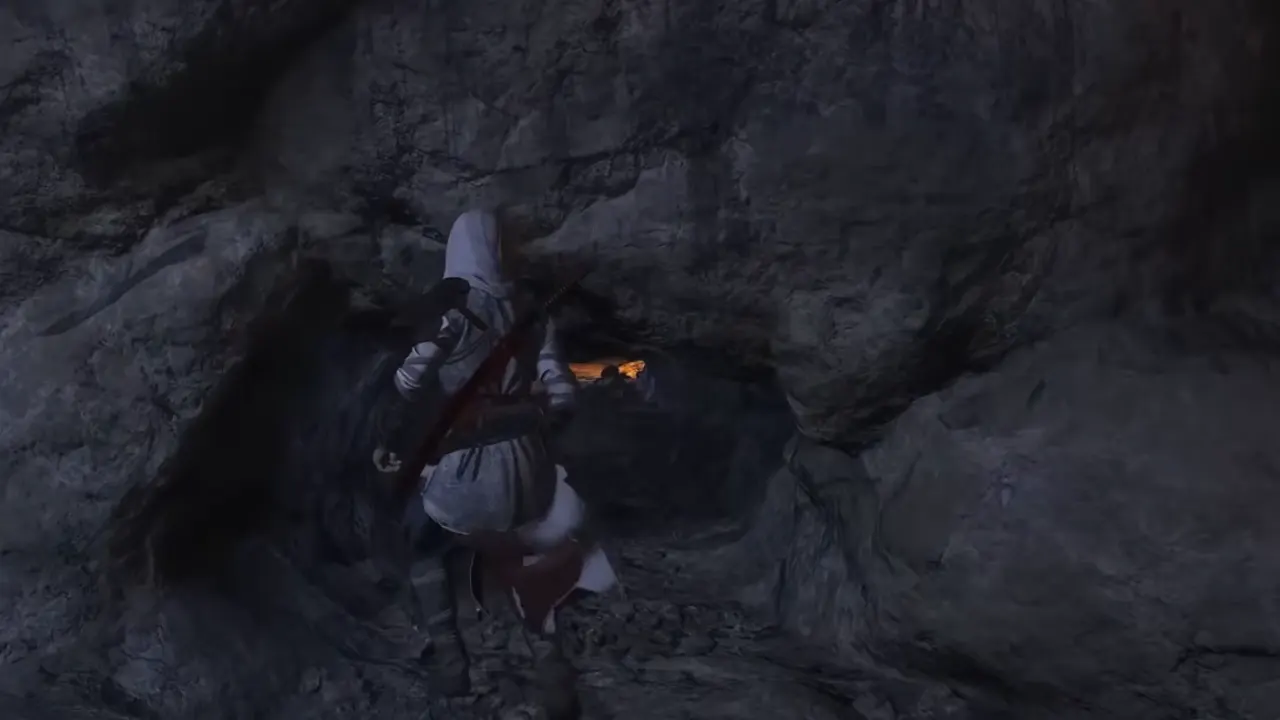 Naoe crawling through small narrow tunnel in the cave