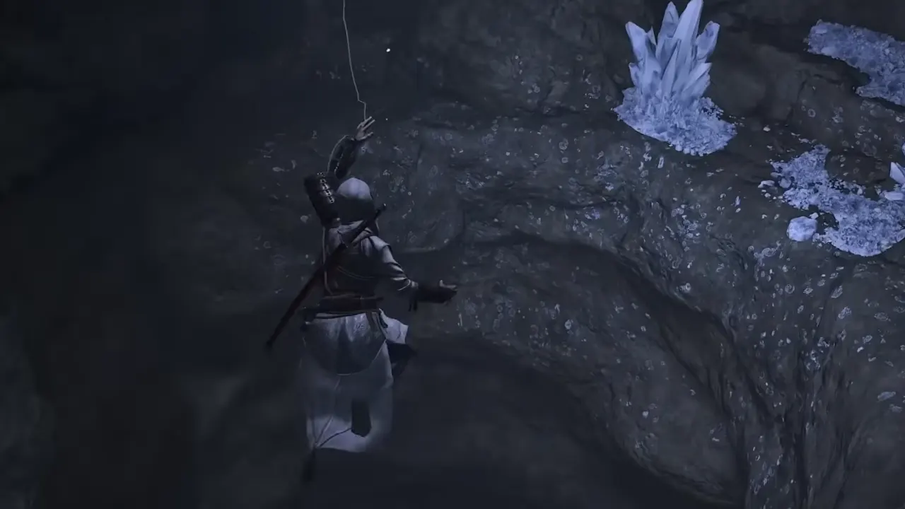 Naoe grappling down in cave in AC Shadows Attack of Tital quest