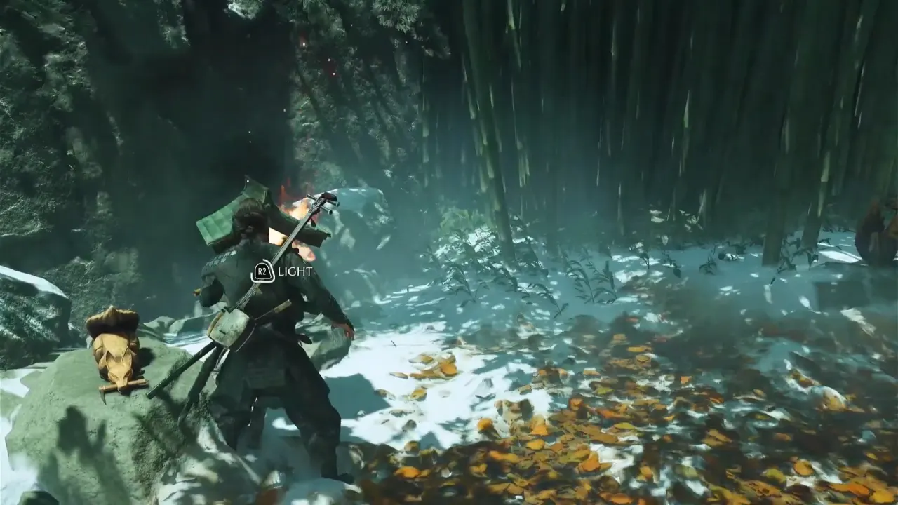 Lighting the lantern next to lying fox statue in Ghost of Yotei