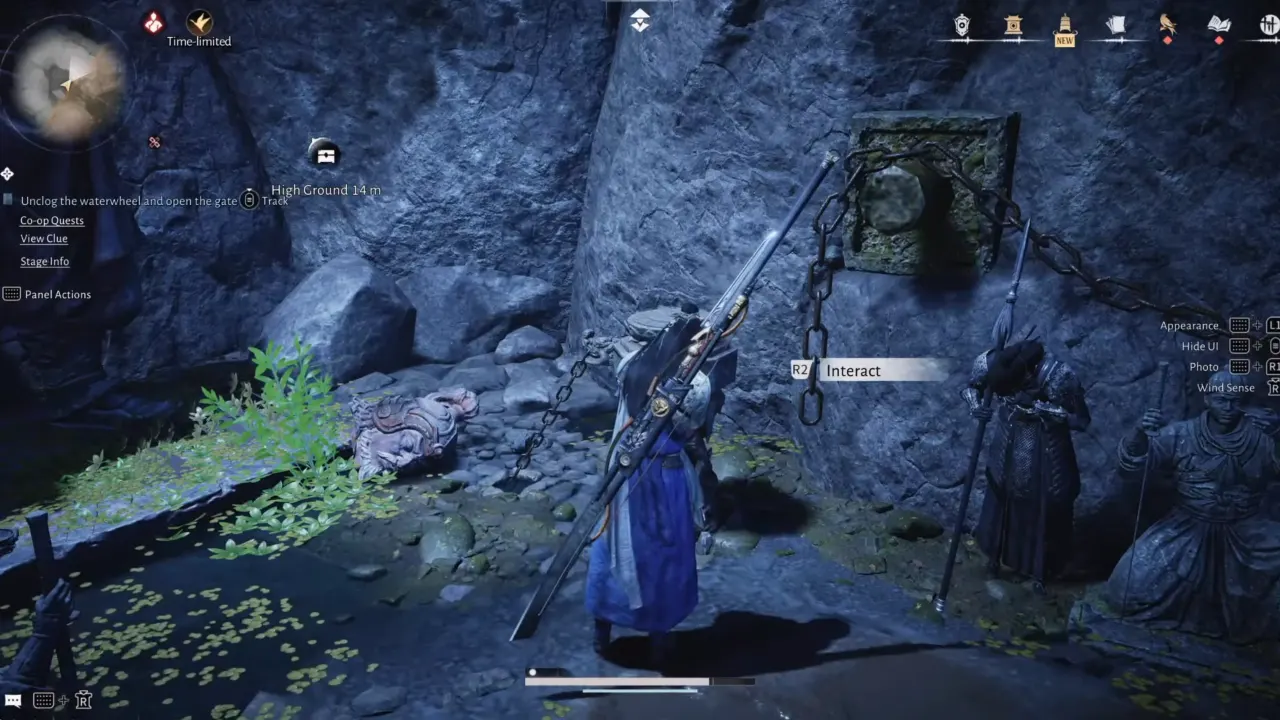 Interacting with the mechanism to turn the wheel behind waterfall.