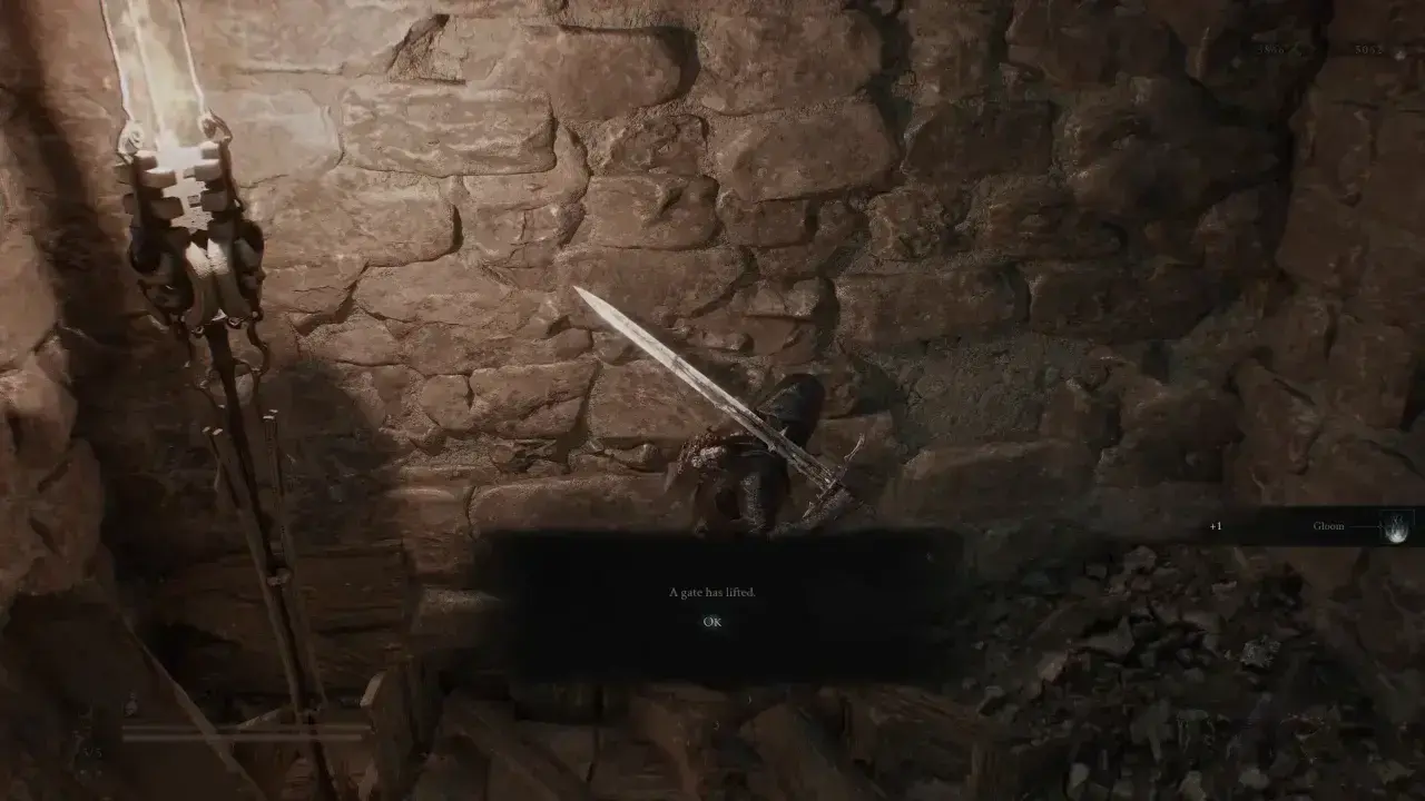 Interact with plate to open gate in Holding Cells dungeon corridor.