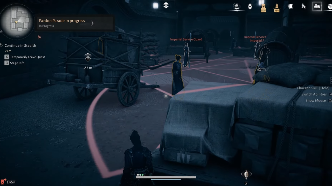 Continue in stealth behind carts and boxes